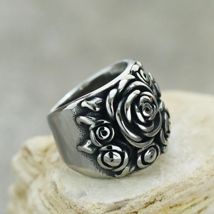Vintage silver rose flower relief ring made of titanium steel on natural white stone base