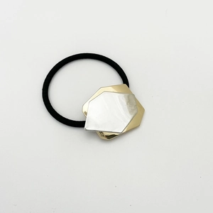 Detail of high-elastic black hair tie with geometric gold and silver alloy plates