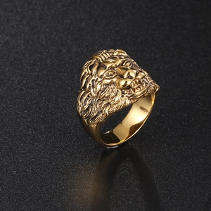 Macro detail of golden lion head ring with embossed 3D sculpture and metallic texture