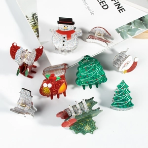 Sparkly Christmas hair claw clips set featuring snowman and tree designs in festive colors