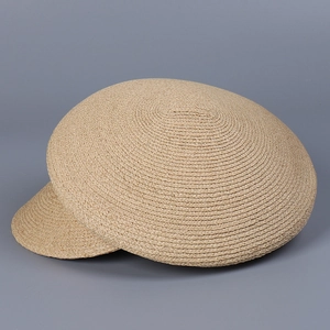 Detailed close-up showing the intricate weave and texture of a raffia straw baker boy hat