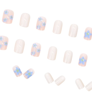 Short round press-on nails set with creamy white and blue floral patterns on pink base