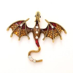 Vintage golden dragon brooch with red enamel and sparkling crystal rhinestones inlay