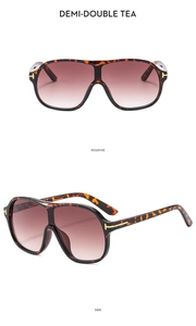 Macro shot of oversized tortoise shell pilot sunglasses with gradient tea lenses and T hinges