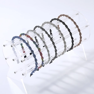 Sparkling crystal-encrusted headbands in multiple colors on a clear display stand
