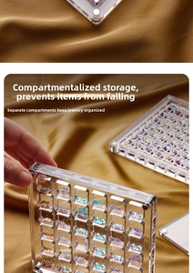Close-up of a clear acrylic nail art organizer with multiple magnetic compartments