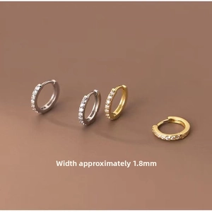 Detailed macro view showing the 1.8mm width of silver and gold crystal hoop earrings