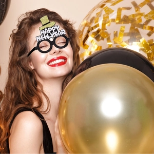 Close-up of model wearing Happy New Year glitter glasses for 2026 party decoration