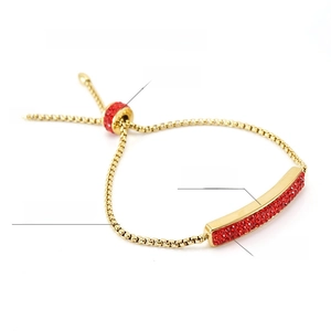 Detail view of 18K gold plated slider bracelet with red rhinestones and 93mm max diameter