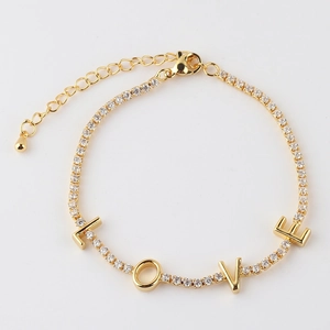 Detailed close-up of 18K gold plated tennis chain featuring LOVE letter charms and zircons