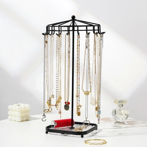 Black metal jewelry organizer with 18 hooks and square acrylic base for necklaces
