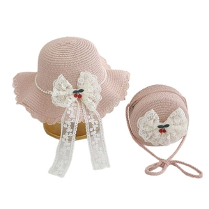 Pink girls straw sun hat and matching round bag set with lace bows and cherry charms