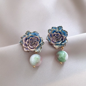 Vintage blue rose oil-drop earrings with ceramic beads on elegant silk background