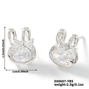 Macro shot showing dimensions of silver rabbit stud earrings with white zircon crystals