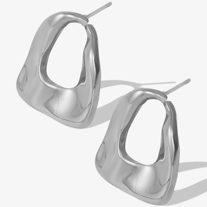 Macro shot of silver oval geometric earrings with polished 304 stainless steel texture