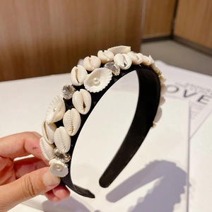 Baroque ocean style headband with natural white shells and pearls on a black base