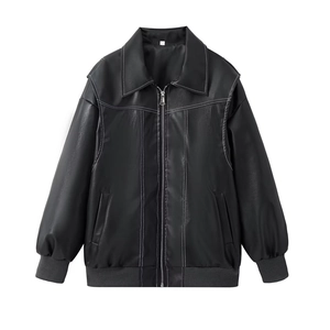Close-up of black faux leather jacket with contrast white stitching and metal zipper detail