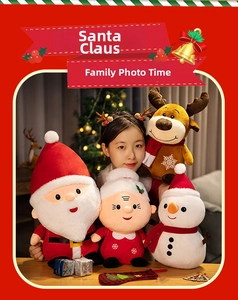 Close-up of plush Christmas toy set with detailed snowflake embroidery in warm setting