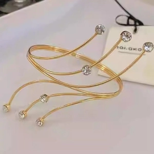 Elegant gold spiral multilayer arm cuff with sparkling round crystal accents for women