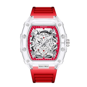 Detailed close-up of a red transparent tonneau-shaped watch with a skeleton dial and rubber strap