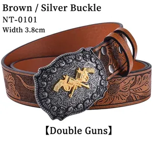 Detail of 3.8cm brown leather western belt with silver shield buckle and golden dual pistols