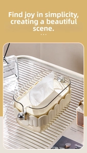 Detail of luxury cream white wave tissue box with silver spheres and transparent acrylic lid