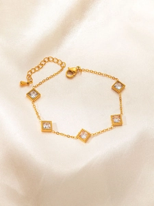 Vintage gold titanium steel bracelet featuring five square emerald-cut cubic zirconia stones