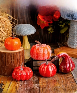 Detailed close-up of realistic artificial foam pumpkins for rustic autumn harvest decor
