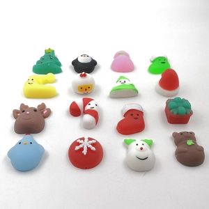 Close-up of a 16-piece set of Christmas squishy toys including snowmen and reindeer