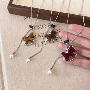 Vintage flocked rocking horse necklace with pearls and snake chain in three classic colors
