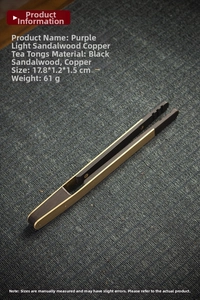 Detailed view of ebony wood and copper tea tongs measuring 17.8cm on a textured blue mat