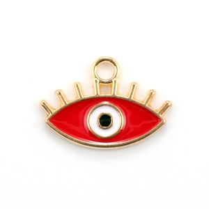 Macro view of a red evil eye charm with gold metal eyelashes for DIY jewelry making