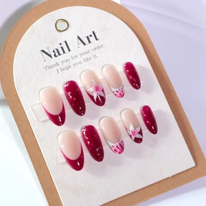 French burgundy press-on nails with 3D white flowers and almond shape gloss finish