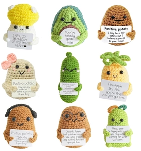 Collection of nine handmade crochet dolls featuring fruit and vegetable characters