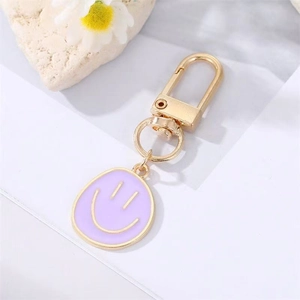 Creative purple enamel smiley face keychain with elegant gold D-ring buckle
