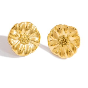 Macro detail of irregular gold flower stud earrings with a polished metallic finish