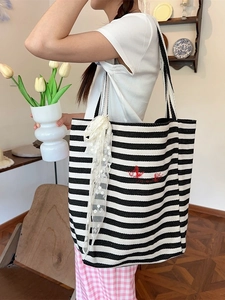 Large black and white striped canvas tote bag with red embroidery and white lace bow