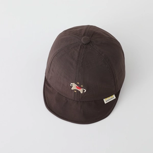 Detail of dark brown baby soft-brim hat with embroidery and brand woven label