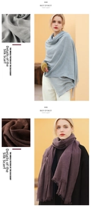 Detail of light blue and dark purple linen-style scarves with delicate fringe edges