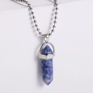 Natural blue hexagonal column stone pendant necklace with silver bead chain on white decor