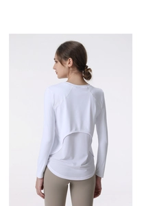 Detailed back view of women's white yoga top featuring breathable mesh splice fabric