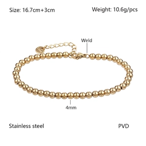 Close-up of 4mm gold beaded stainless steel bracelet with S.Steel engraved tag and lobster clasp