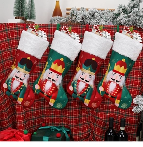Set of four nutcracker soldier Christmas stockings hanging against a festive background