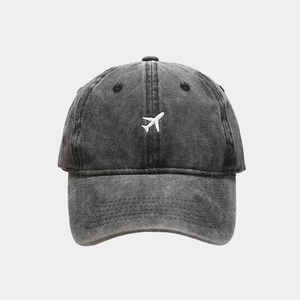 Washed charcoal grey baseball cap featuring white airplane embroidery on the front