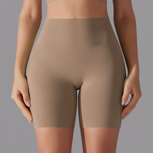 Detail of high-waist seamless yoga shorts in khaki showing premium fabric texture and seams