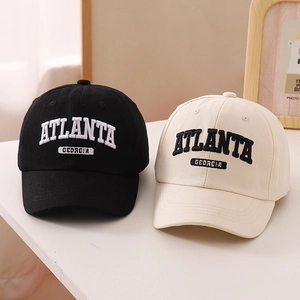 Detail of Atlanta Georgia embroidery on cotton twill baseball caps in black and beige