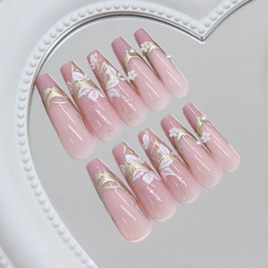 Press-on nails with 3D white flowers and pearls on pink gradient coffin shape