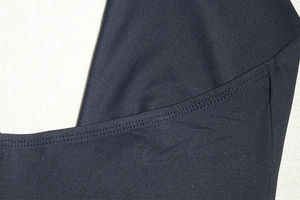 Close-up of high-elasticity fabric texture and professional flatlock seam stitching