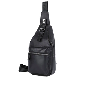 Close-up of black leather chest bag featuring multiple zipper pockets and metal buckles