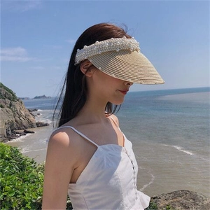 Handmade pearl straw visor hat for women with elegant bead embellishments for beach sun protection